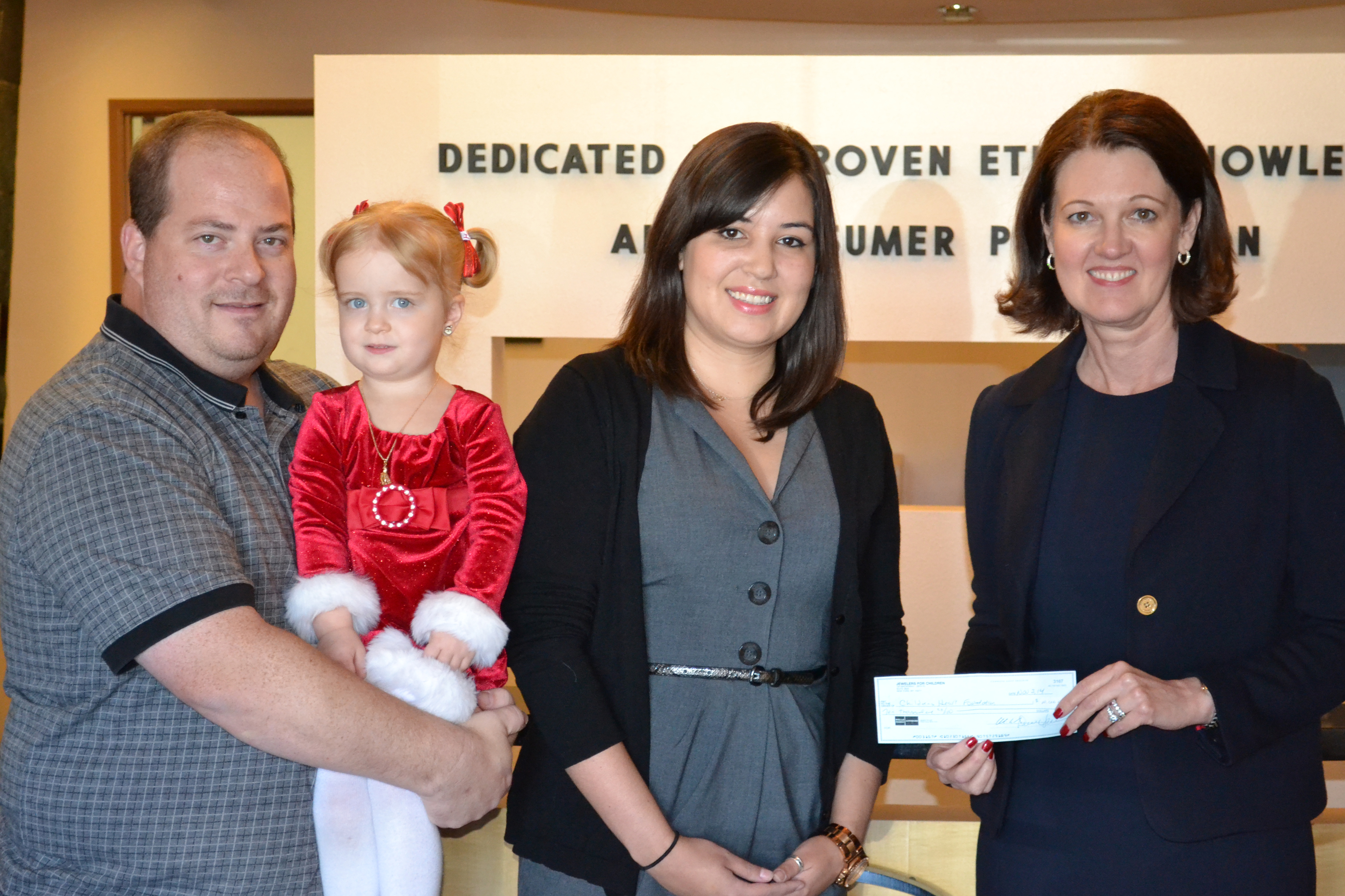 Left to Right: Karl Klein, his daughter Phoebe Rose, Kelley Mazur from the Children’s Heart Foundation and Ruth Batson, CEO of the American Gem Society and AGS Laboratories