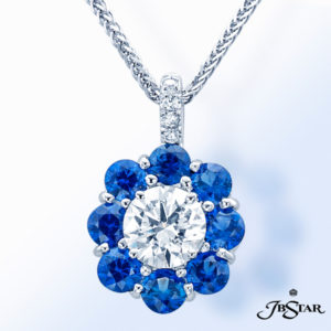 Platinum pendant featuring a round diamond center encircled with perfectly matched round sapphires and pavé accents by JB Star 