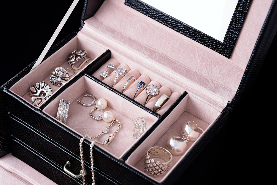 Jewelry box with white gold and silver rings, earrings and penda