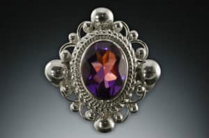 Sterling silver ring set with an oval cut amethyst, by Michael Schofield & Co.
