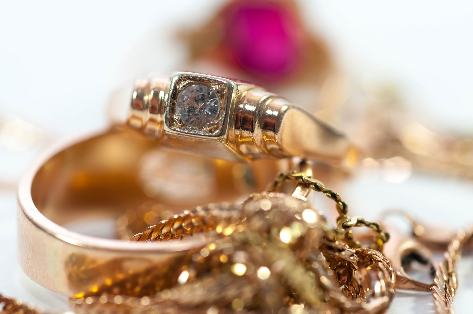 Gold Jewelry  With Gems , Chains Close Up Macro Shot Isolated On