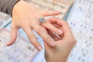 Trying on ring at jewelry store