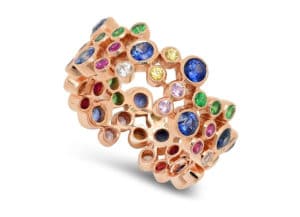 Multi-gemstone ring featuring blue, pink, yellow, and white sapphires, ruby, tsavorite, and diamonds, by Beverley K.