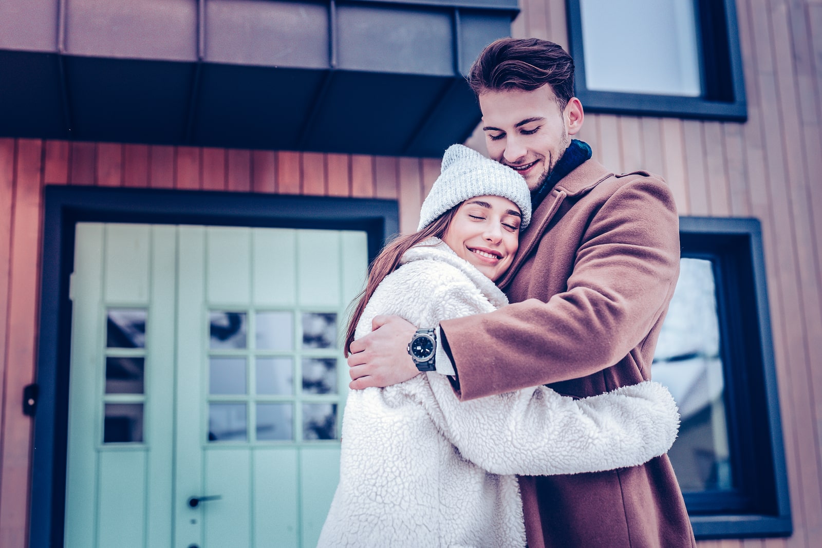 Just Married Couple Hugging Standing Outside Their New House