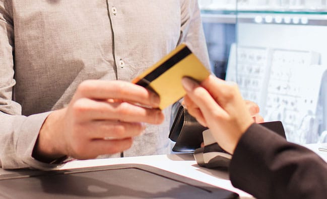 Using credit card at jewelry store counter