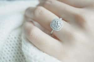 Close up Diamond ring on woman's finger before wedding