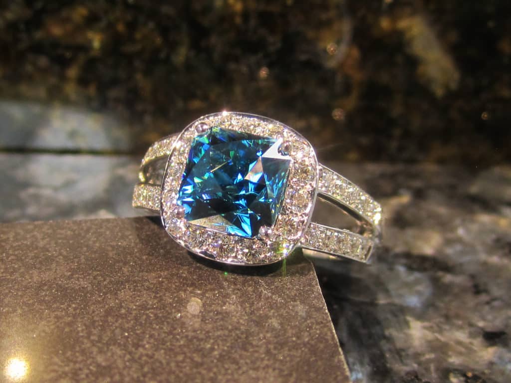 Blue zircon and diamond ring by Suna Bros.