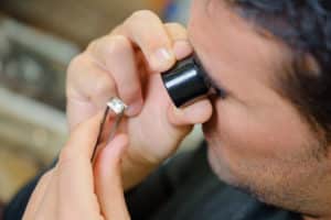 Jeweler appraising a ring