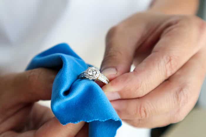 Jeweler polishing a ring