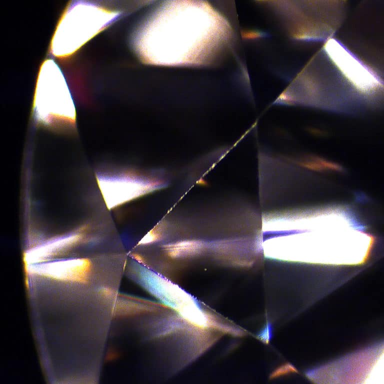 Abrasion on the facet junction between the star and bezel facet on the crown of a diamond.