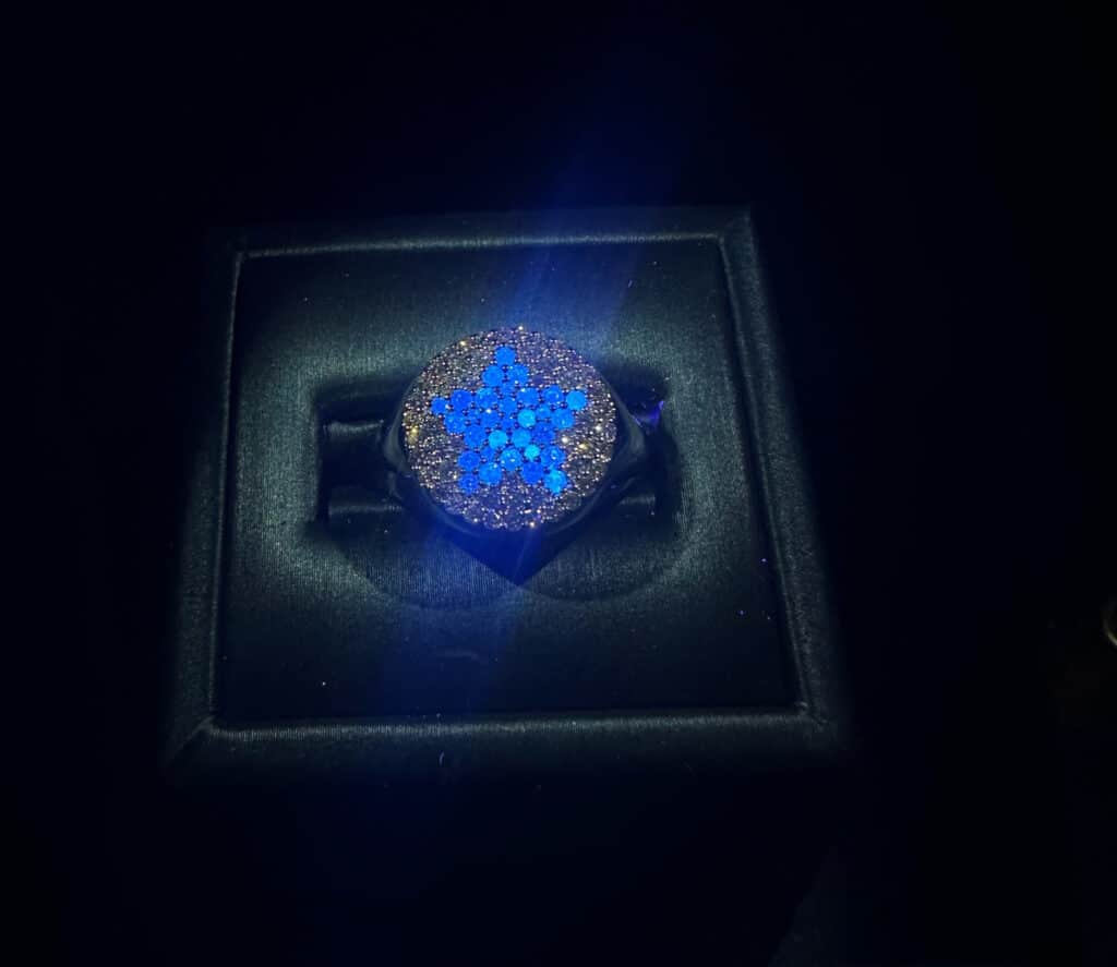 The Patriot Ring by VEER features a star shape of blue fluorescing diamonds.
