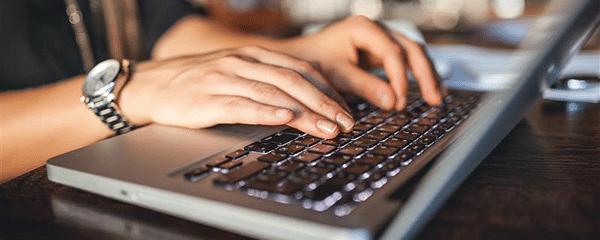 Person typing on a laptop